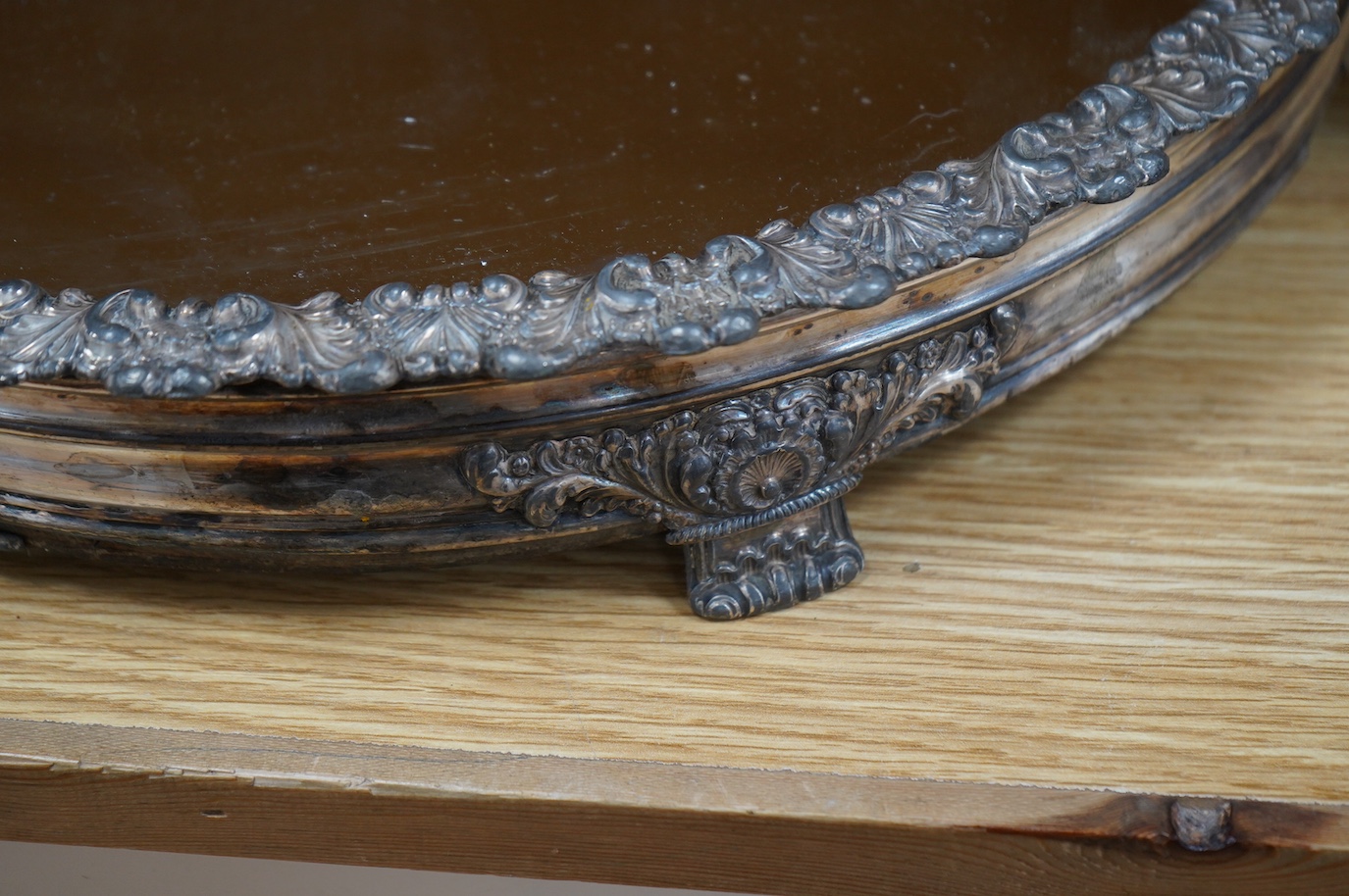 A Victorian silver plated and mirrored circular wedding cake plateau, 38.5cm diameter. Condition - plate worn in places